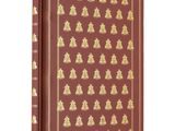 un livre rouge orné de motifs dorés sur fond blanc