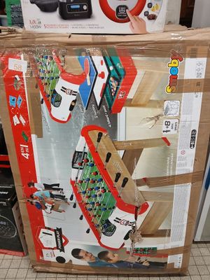a cardboard box with a toy train on top of it