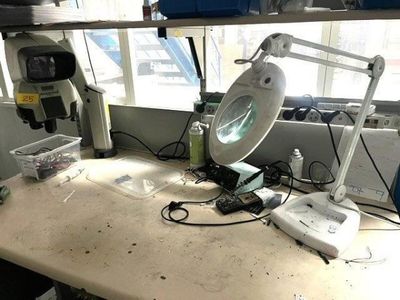 an image of a desk with a lamp on it