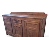 an image of a large wooden cabinet with drawers
