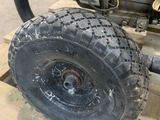 a small engine on a pallet with a tire