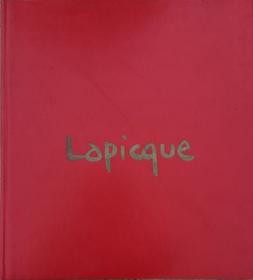 a close up of a red book with the word lapique written on it