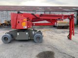 a red crane that is parked in a parking lot
