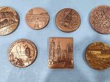 six different types of coins are shown on a blue surface