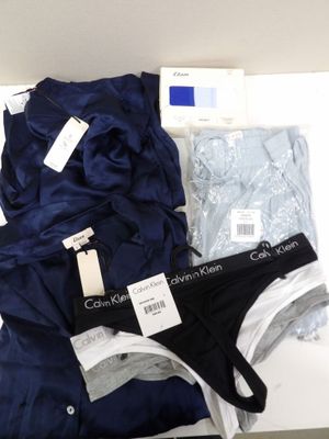 three pairs of men ' s underwear sitting on top of a white table