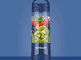 a blender that has a lot of fruit in it