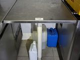 a table that has two containers of water under it