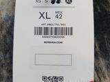 a tag that says xs xxl on it next to a pair of scissors