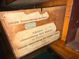 a wooden box that has a sign on it