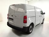 a white van that is parked in a white room