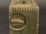a small wooden box with a hole in it