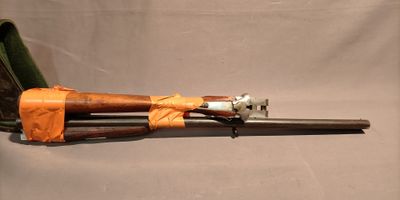 a gun that is sitting on top of a bag