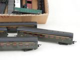 four toy trains sitting next to each other in a box