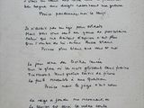 a handwritten poem on a piece of paper on a table