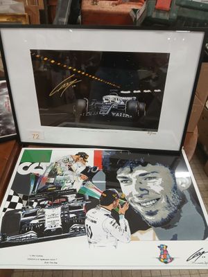 signed autographed photograph of a racing car and a signed photograph of a man