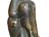 statue of a woman sitting on her knees with her hands on her knees