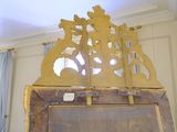a wooden easel with a painting on top of it