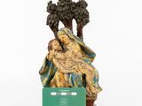 an image of a figurine of a woman holding a child