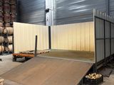 a skateboard ramp in the middle of a warehouse