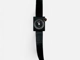 black leather strap on a watch on a white background