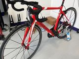 a red bike that is parked in a garage