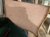 a man that is holding a piece of wood in his hand