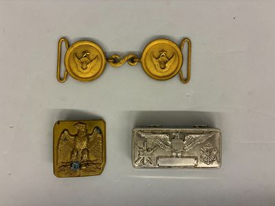 three different types of gold and silver jewelry on a white surface
