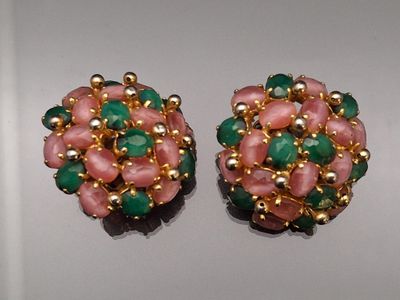 pair of pink, green and gold earrings on a white surface
