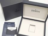 a box with a watch inside of it on a table