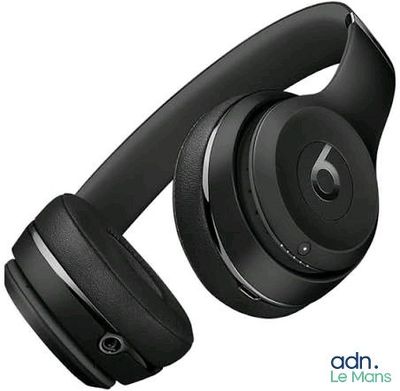the beats on ear headphones are black and have a built - in microphone