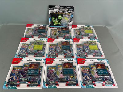 a lot of pokemon trading cards on the table