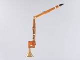 a pencil stuck in the end of a trumpet