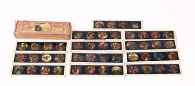 a lot of different pictures on a table with a box