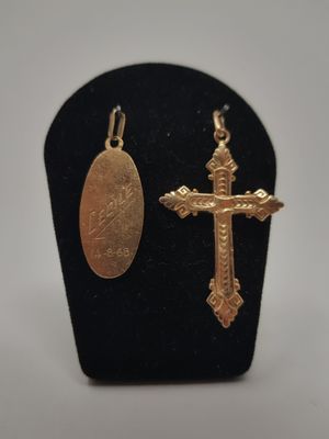 a close up of a cross and a medal on a display