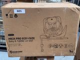 a cardboard box that has a baby and toddler car seat on it