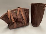 a pair of brown bags sitting next to each other on a table