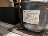 a large metal pot sitting on top of a table
