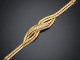 un bracelet en or et diamants, par Cartier