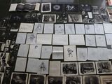 a lot of pictures on the floor of this room