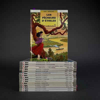 books stacked on top of each other on a black surface