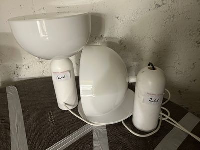 a white sink and a white toilet in a bathroom