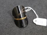 a ring that is sitting on a table with a price tag