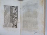 an open book with a picture of a building on it