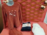 a pink bed with a pink blanket and a pink blanket