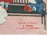two children sitting on a bench in the snow