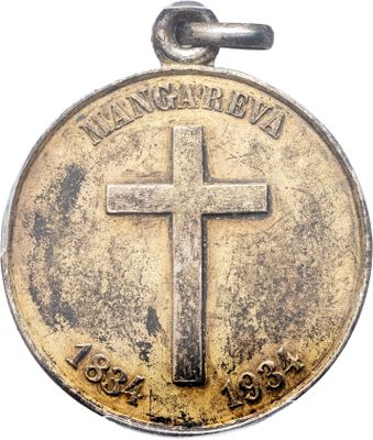 une vieille pièce sur laquelle figure une croix