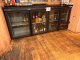 a bar with several bottles of alcohol on the shelves