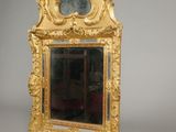 a mirror with a gold frame and a mirror with a clock on it