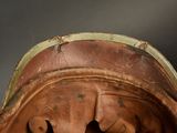 a close up of a helmet with a bug on it