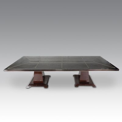 a black marble dining table with two wooden legs